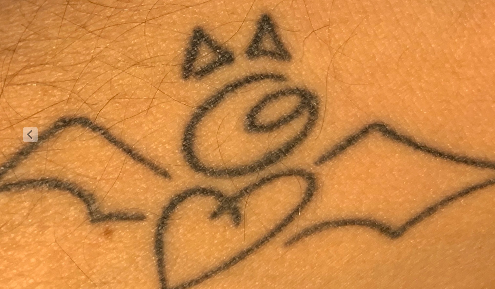 Tattoo of a hand-drawn symbol